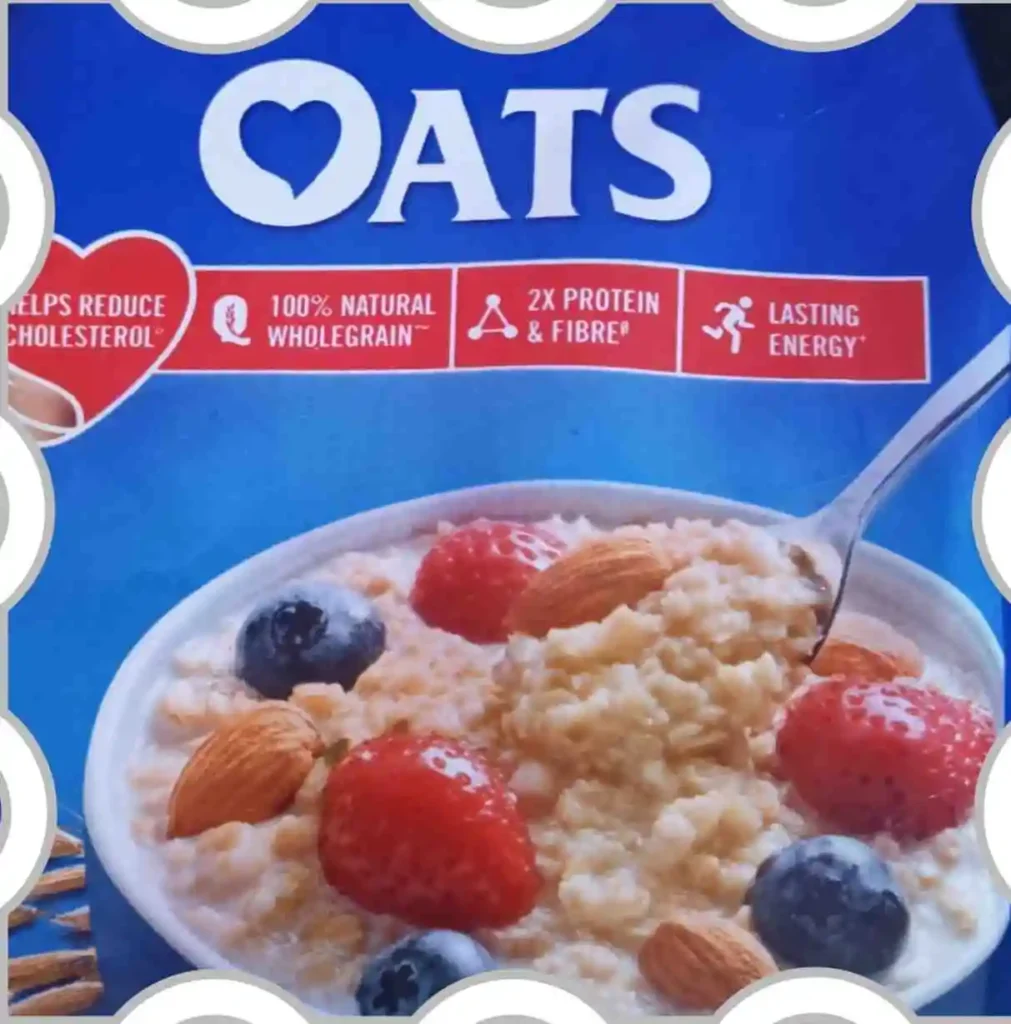 Bowl of creamy oats topped with fresh strawberries, blueberries, and almonds, highlighting whole grain nutrition, fiber, protein, and lasting energy benefits.